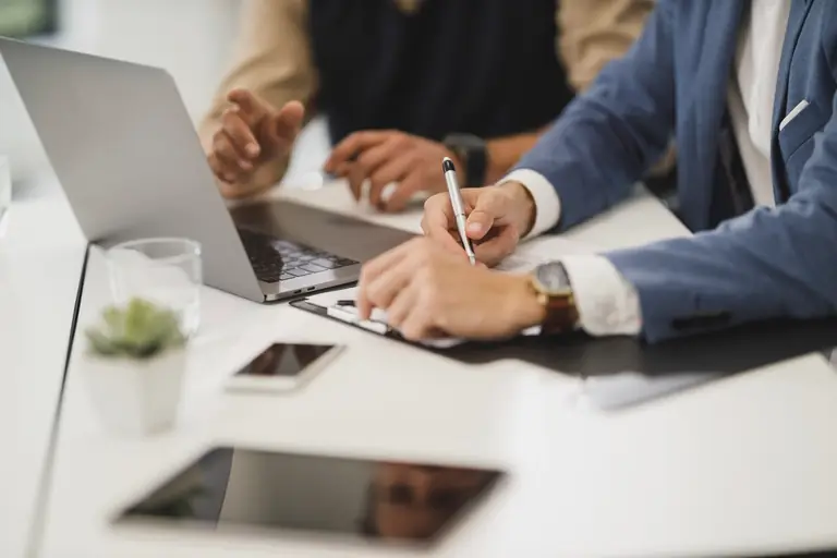 Accountant and client going over figures at a desk